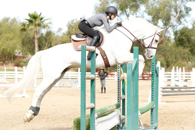 Helen Pollock from Life Equestrian at Storia Stables jumping with a CWD Saddle