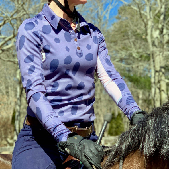 Horseback rider wearing long sleeve sun shirt polo with UPF or SPF protection and dark blue appaloosa spots design