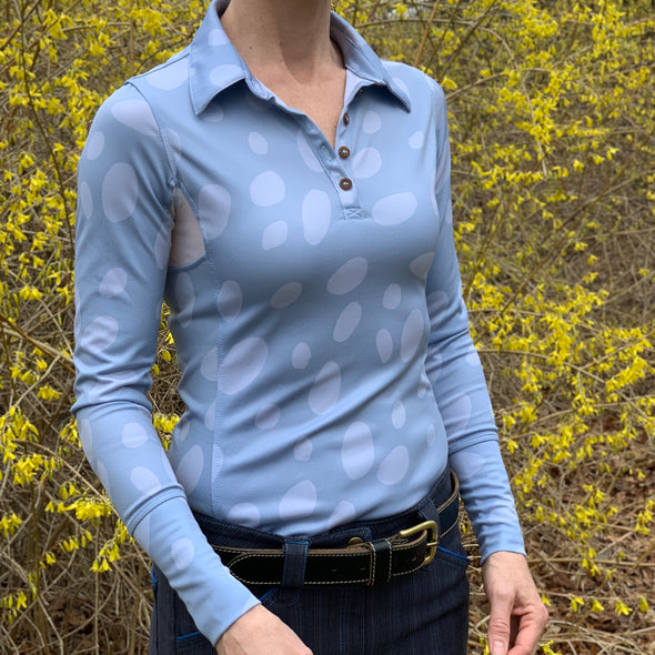 woman wearing long sleeve sun shirt polo with UPF or SPF protection and light blue appaloosa spots design