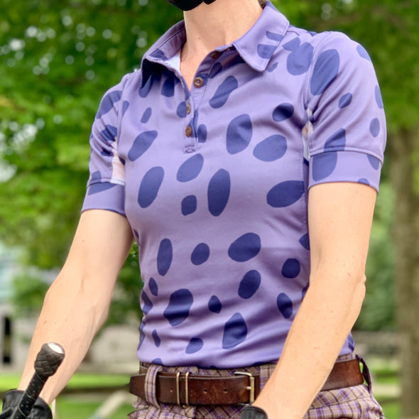 horseback rider wearing short sleeve sun shirt polo with UPF or SPF protection and dark blue appaloosa spots design